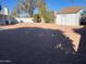 Large backyard with gravel, shed and trees at 1714 N Pleasant Dr, Chandler, AZ 85225