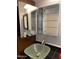 Modern bathroom with glass sink and mirrored medicine cabinet at 1714 N Pleasant Dr, Chandler, AZ 85225