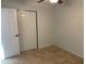 Bright bedroom with tile floors and neutral walls at 1714 N Pleasant Dr, Chandler, AZ 85225