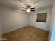 Spacious bedroom with tile floors and ceiling fan at 1714 N Pleasant Dr, Chandler, AZ 85225