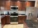 Updated kitchen with stainless steel appliances and cabinetry at 1714 N Pleasant Dr, Chandler, AZ 85225