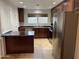 Modern kitchen with stainless steel appliances and ample cabinetry at 1714 N Pleasant Dr, Chandler, AZ 85225