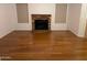 Living room with hardwood floors and brick fireplace at 1714 N Pleasant Dr, Chandler, AZ 85225