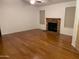 Living room with hardwood floors and brick fireplace at 1714 N Pleasant Dr, Chandler, AZ 85225