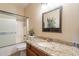 Bathroom with granite countertop and a bathtub at 17581 W Canyon Ln, Goodyear, AZ 85338