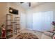 Well-lit bedroom with double doors and tile floors at 17581 W Canyon Ln, Goodyear, AZ 85338