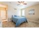 Bedroom features a queen bed, ceiling fan, and access to the bathroom at 17581 W Canyon Ln, Goodyear, AZ 85338