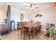 Bright dining area with a six-chair table and ceiling fan at 17581 W Canyon Ln, Goodyear, AZ 85338