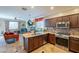 Kitchen with granite countertops, stainless steel appliances, and dark cabinets at 17581 W Canyon Ln, Goodyear, AZ 85338