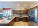 Modern kitchen featuring granite countertops and stainless steel appliances at 17581 W Canyon Ln, Goodyear, AZ 85338