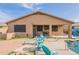 Patio area with seating and a pool view at 17581 W Canyon Ln, Goodyear, AZ 85338