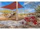 Community playground with slide and shade structure at 17581 W Canyon Ln, Goodyear, AZ 85338