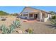 Exterior view of the house showing a covered patio and xeriscaping at 17906 N Encanto Dr, Surprise, AZ 85374