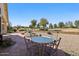 Backyard featuring a covered patio with golf course views at 17906 N Encanto Dr, Surprise, AZ 85374