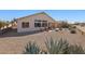 Exterior view of the house showing a covered patio and xeriscaping at 17906 N Encanto Dr, Surprise, AZ 85374