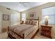 Cozy bedroom featuring a comfortable bed, neutral color scheme, and ample natural light from the windows at 17906 N Encanto Dr, Surprise, AZ 85374