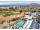 A resort style community pool with many people enjoying it at 17906 N Encanto Dr, Surprise, AZ 85374