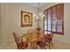 Cozy dining room featuring a wooden table with seating for six, a chandelier, and elegant decor at 17906 N Encanto Dr, Surprise, AZ 85374