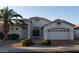 Single-story home with stucco exterior, two-car garage, and desert landscaping at 17906 N Encanto Dr, Surprise, AZ 85374