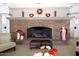 A cozy brick fireplace, perfect for gatherings at 17906 N Encanto Dr, Surprise, AZ 85374