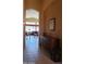 Hallway with tile flooring, leading to living room at 17906 N Encanto Dr, Surprise, AZ 85374