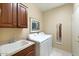 Laundry room featuring a sink and modern washer and dryer at 17906 N Encanto Dr, Surprise, AZ 85374