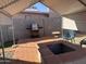 Relaxing backyard patio with fire pit and grill under covered structure at 2118 E Oak St, Phoenix, AZ 85006