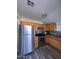 Updated kitchen features stainless steel appliances and wood cabinets at 2118 E Oak St, Phoenix, AZ 85006