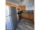 Modern kitchen with stainless steel appliances and wood cabinetry at 2118 E Oak St, Phoenix, AZ 85006