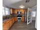 Updated kitchen with stainless steel appliances and wood cabinets at 2118 E Oak St, Phoenix, AZ 85006