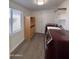 Laundry room with washer, dryer, and built-in shelving at 2118 E Oak St, Phoenix, AZ 85006