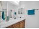 Clean bathroom featuring a white quartz counter, decorative touches, and bright natural light at 22717 W Sierra Ridge Way, Wittmann, AZ 85361