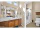 Bright bathroom featuring neutral walls, white quartz counter, and glass shower at 22717 W Sierra Ridge Way, Wittmann, AZ 85361