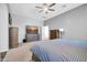 Spacious bedroom with carpet and furniture, featuring an ensuite bathroom at 22717 W Sierra Ridge Way, Wittmann, AZ 85361