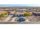 Stunning front exterior view of a home featuring a circular driveway and desert landscaping at 22717 W Sierra Ridge Way, Wittmann, AZ 85361