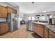 Bright kitchen with stainless steel refrigerator and plenty of counter space at 22717 W Sierra Ridge Way, Wittmann, AZ 85361