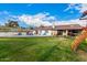 Expansive backyard featuring a refreshing pool, a playground, and a well-maintained lawn at 2401 E Christy Dr, Phoenix, AZ 85028