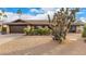 Charming single-story home with desert landscaping and a two-car garage at 2401 E Christy Dr, Phoenix, AZ 85028