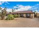 Well-maintained single story home with desert landscaping and matching shutters at 2401 E Christy Dr, Phoenix, AZ 85028