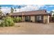 Well-maintained single story home with desert landscaping and matching shutters at 2401 E Christy Dr, Phoenix, AZ 85028