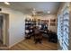 Home office with a desk, chair, and built-in shelving at 2401 E Christy Dr, Phoenix, AZ 85028