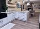 Modern kitchen featuring white cabinets, granite countertops, and a farmhouse sink at 2401 E Christy Dr, Phoenix, AZ 85028