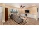 Inviting living room with modern ceiling fan, recessed lighting, and a comfortable gray couch at 2401 E Christy Dr, Phoenix, AZ 85028