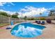 Sparkling pool surrounded by a concrete deck and secure fencing, perfect for summer relaxation and fun at 2401 E Christy Dr, Phoenix, AZ 85028