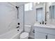 Modern bathroom with white vanity, marble shower, and bathtub at 25232 S Pyrenees Ct, Queen Creek, AZ 85142