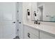 Modern bathroom with single vanity and white cabinets at 25232 S Pyrenees Ct, Queen Creek, AZ 85142