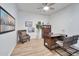 Home office with wood desk, comfortable chair, and hardwood floors at 25232 S Pyrenees Ct, Queen Creek, AZ 85142