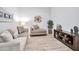 Relaxing sitting area with neutral-toned furniture and wood floors at 25232 S Pyrenees Ct, Queen Creek, AZ 85142