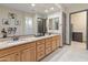 Bathroom boasts double sinks, granite counters, and modern fixtures at 26647 W Covey Ln, Buckeye, AZ 85396