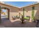 Private courtyard with fountain, seating area, and lush greenery at 26647 W Covey Ln, Buckeye, AZ 85396